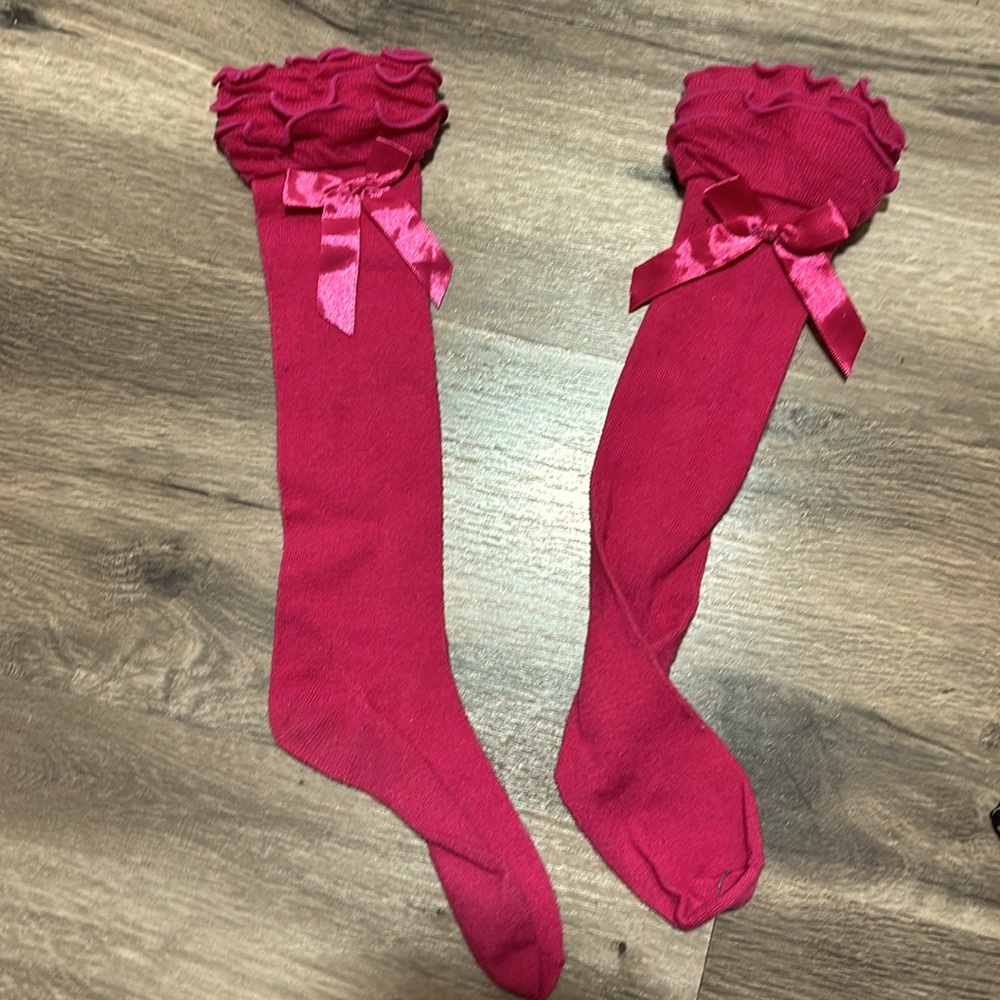 Hot pink boot socks with bows on side